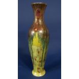 A good quality Wilkinson pottery Tibetan vase of elongated ovoid form with painted and gilded