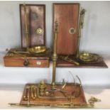 A large collection of various brass and mahogany balance scales and accessories