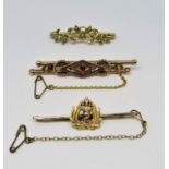 Three antique gold bar brooches; a 9ct pink topaz and diamond example, an unmarked bow example set