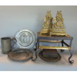 A good quality brass and wrought iron trivet, the top pierced with a lion and unicorn around a