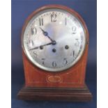 Edwardian mahogany and boxwood inlaid three train musical mantle clock with convex silvered dial, 33