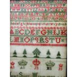 A 19th century needlework sampler by Janet Scott March, Dated 1857, incorporating alphabet, trees,