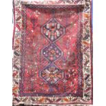 Afghan three medallion rug decorated with various still life's upon a red ground, 170 x 125 cm