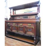 A good quality aesthetic period sideboard in mahogany, the lower section fitted with four carved and