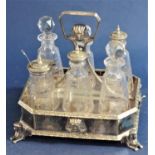 A good quality silver plated Egyptian revival six bottle cruet, the bottles engraved with Greek