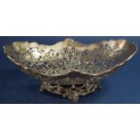 Edwardian silver oval fruit bowl with raised pierced Rococo sides upon a cast silver base, maker
