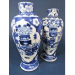 A pair of 19th century Chinese blue and white vases of shouldered form with reserved painted