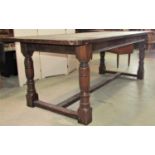 A good quality Old English style oak refectory table, the rectangular top with cleated ends raised