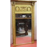 A Regency period pier glass, the mirror plate set within two bobbin moulded columns, with acanthus