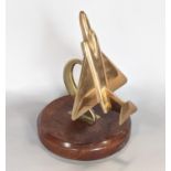 Trench Art Interest - An artificer-art model of an early jet at a steep incline on a circular wooden