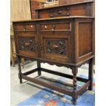 A small 1920s Jacobean revival sideboard/dresser with applied mouldings and rail back over two