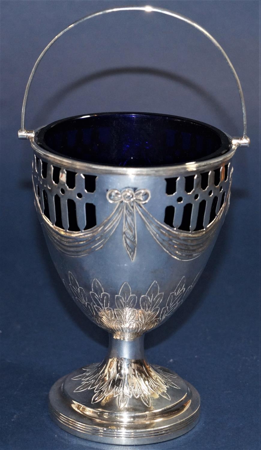 Georgian silver sugar basket, with pierced bowl and floral garlands with darted acanthus engraved