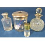 Four various silver topped dressing table glass containers/bottles, the largest 12 cm high (4)
