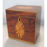 A Georgian mahogany tea caddy of cubic form with inlaid detail