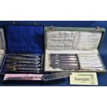 A box containing a collection of mainly continental silver plated cutlery sets