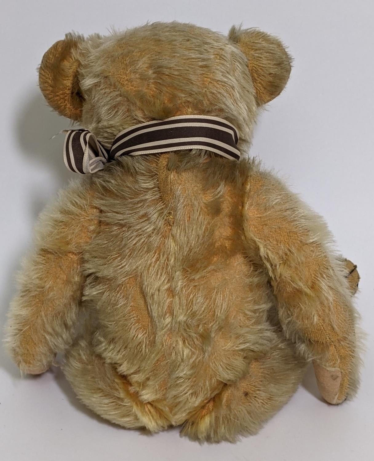 1930's teddy bear possibly by Merrythought with golden mohair, slight humped back, glass eyes, - Image 4 of 5