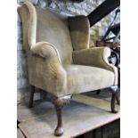 A good quality Georgian style wing armchair with shaped outline, repeating chevron patterned