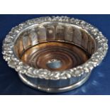 Early 19th century silver wine coaster with cast scallop shell rococo rim and faceted bowl, turned