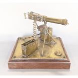 Trench Art Interest - military interest: a detailed brass model of a machine gun, with magazine shel