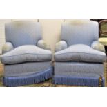 A pair of good quality upholstered drawing rooms chairs by Howard chairs ltd London raised on a