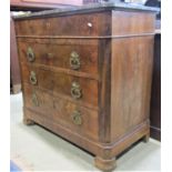 A 19th century figured walnut veneered commode of four long drawers with cast gilt metal drop