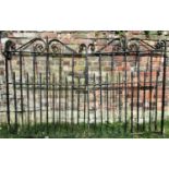 A pair of good quality heavy iron work entrance gates, with vertical spars and scrolled detail,