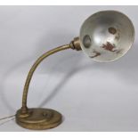 A vintage students/desk lamp with adjustable frame on a weighted and stepped base