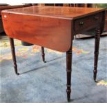 A small Regency mahogany Pembroke table with reeded outline and incorporating a frieze drawer raised