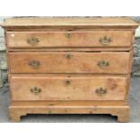 An old reclaimed stripped pine bedroom chest of three long graduated drawers raised on bracket