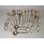 A collection of Old English rat tail silver spoons comprising two coffee spoons, nine teaspoons,