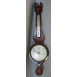 A Georgian mahogany wheel barometer with shell and cornucopia inlaid detail, silvered dials - L