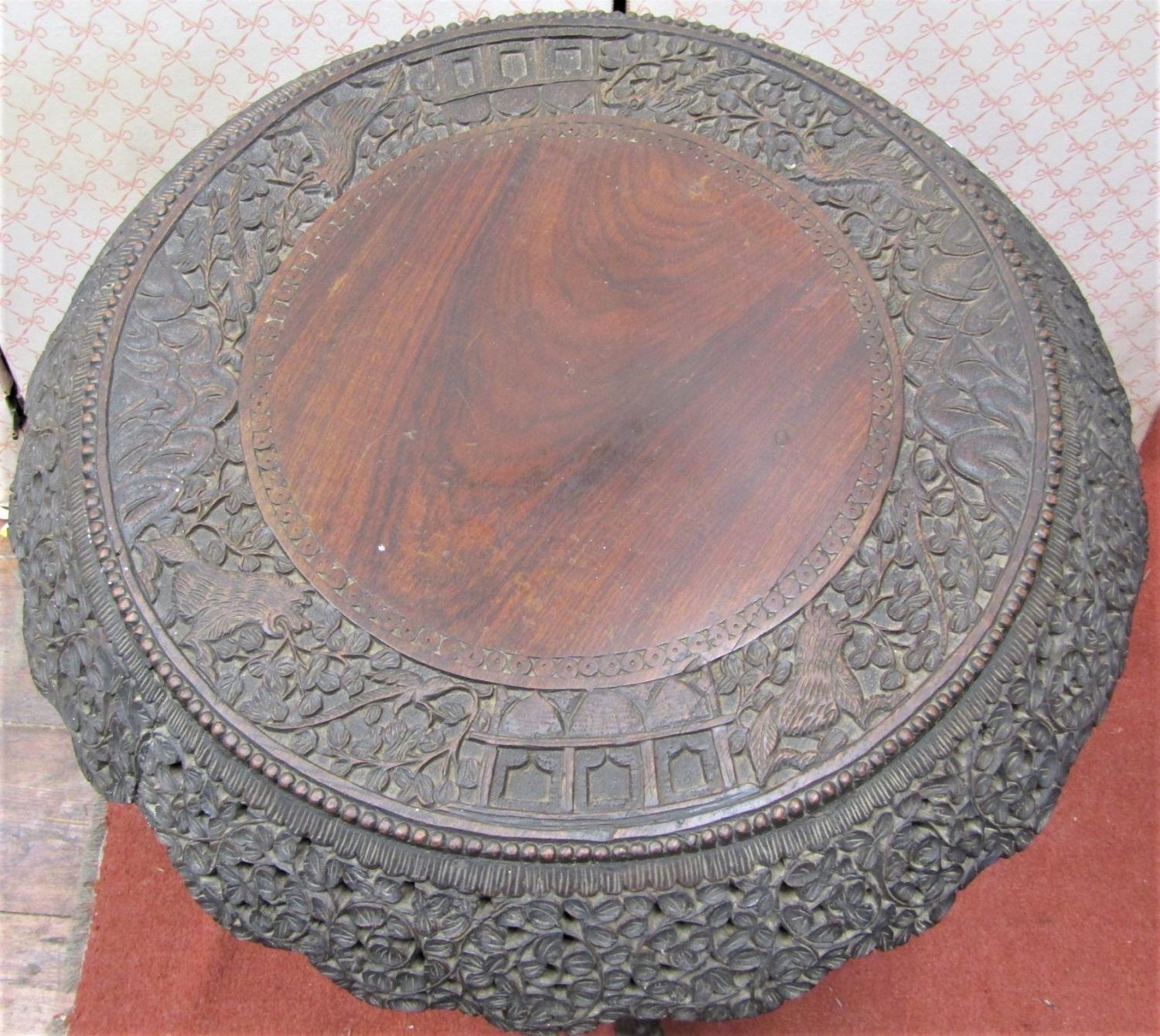 A 19th century Indonesian hardwood occasional table with circular top and carved and pierced - Image 2 of 3