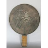 A 19th century Japanese mirror of circular form, to the reverse chrysanthemums and script