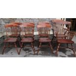 A set of eight (6&2) good quality reproduction Windsor style tapered stick back dining chairs in elm