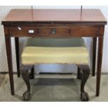 A Georgian mahogany foldover top tea table of rectangular form with inlaid detail and fitted with