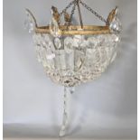 A cut glass basket shaped ceiling light with prism and other drops