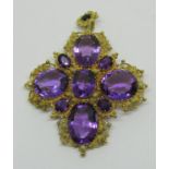 Good 19th century faceted amethyst cross pendant / brooch in yellow metal with intricate