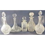 A pair of cut baluster glass lidded jugs together with a further good quality cut glass decanter and