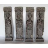 A set of four antique oak carved figures, two male, two female, set against carved backgrounds, 42