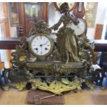 19th century gilt brass mantel clock in the romantic style, with female character floral bouquets,