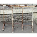 A pair of old ironwork trestles