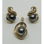 Stylised 14k black pearl and diamond pendant with matching pair of earrings, 15.8g total (3)