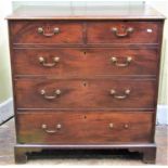 A Georgian mahogany chest of three long and two short graduated drawers, with brass swan necked