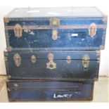 Three similar vintage fibre and leather enforced cabin trunks with metal fittings