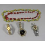 Phenolic green bead necklace with later 9ct clasp and a further graduated carnelian bead necklace
