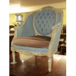 A contemporary open framed elbow chair with carved acanthus floral and other detail, upon a