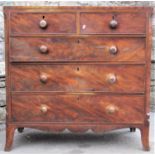 An early 19th century mahogany bedroom chest with ebonised stringing of two short over three long