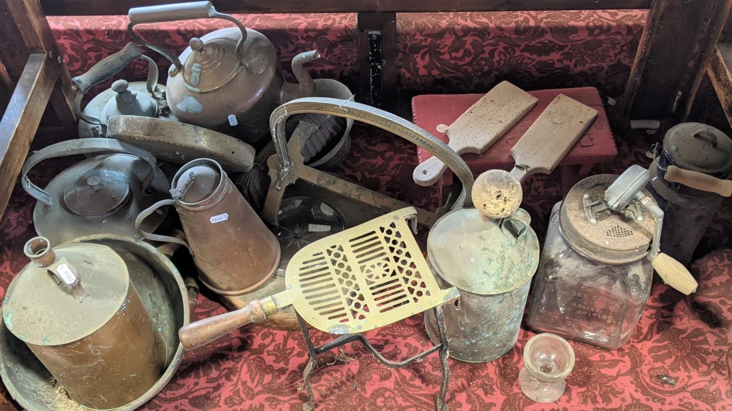 A collection of 19th century and other copperware including kettles, canisters, trivet, house