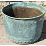 An old weathered (verdigris) copper with riveted seams and folded rim, (drilled with later