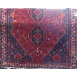 Good quality full pile Afghan runner/carpet with various medallions and still life's upon a red